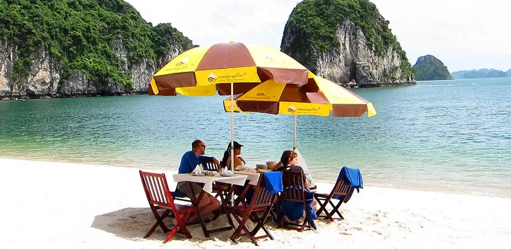 Private family tour dining on beach on Halong Bay, Vietnam